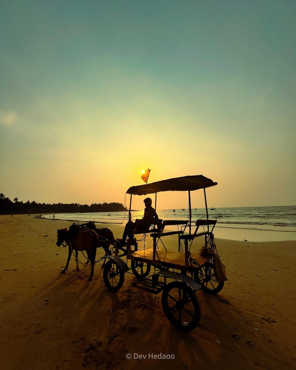 Beach sunset with a cart